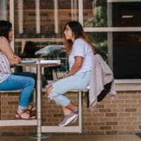 5 Traits of a Disciplemaker | The Navigators Discipleship Resource | Two women eating lunch together outside