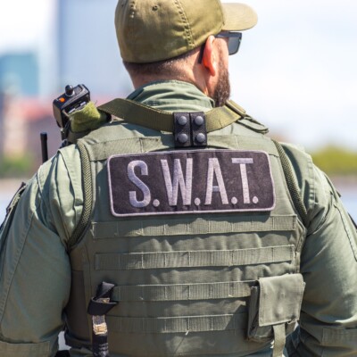 Inside the Heart of Law Enforcement: Jesus Offers Real Hope | Navigators First Responders Ministry | equipped SWAT soldier standing on a pier