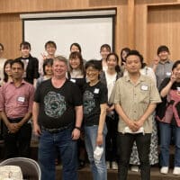 Marc and Yumiko Leis standing with a group of Christians in Japan